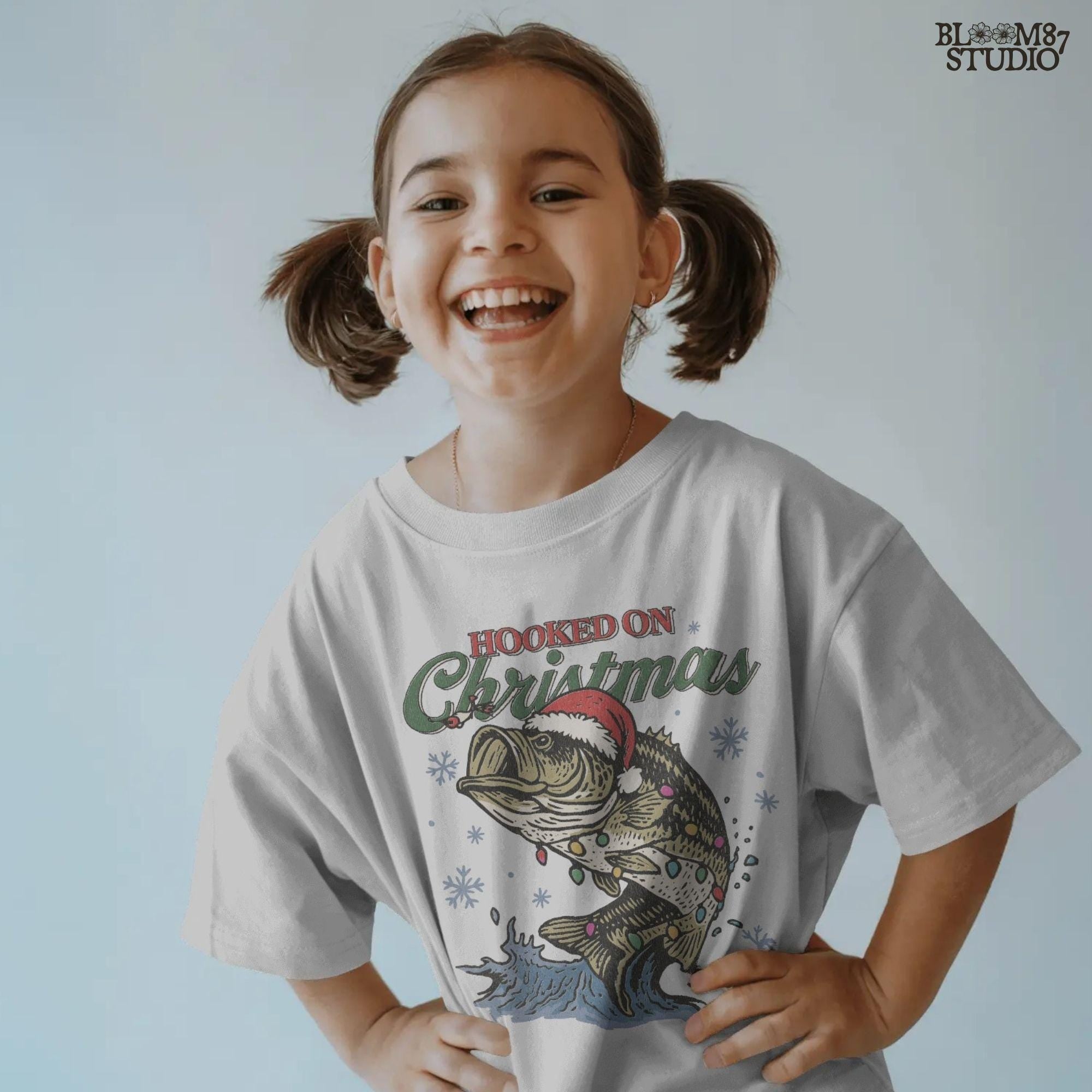 Hooked on Christmas bass fishing PNG design, festive holiday artwork for fishing-themed crafts and apparel.