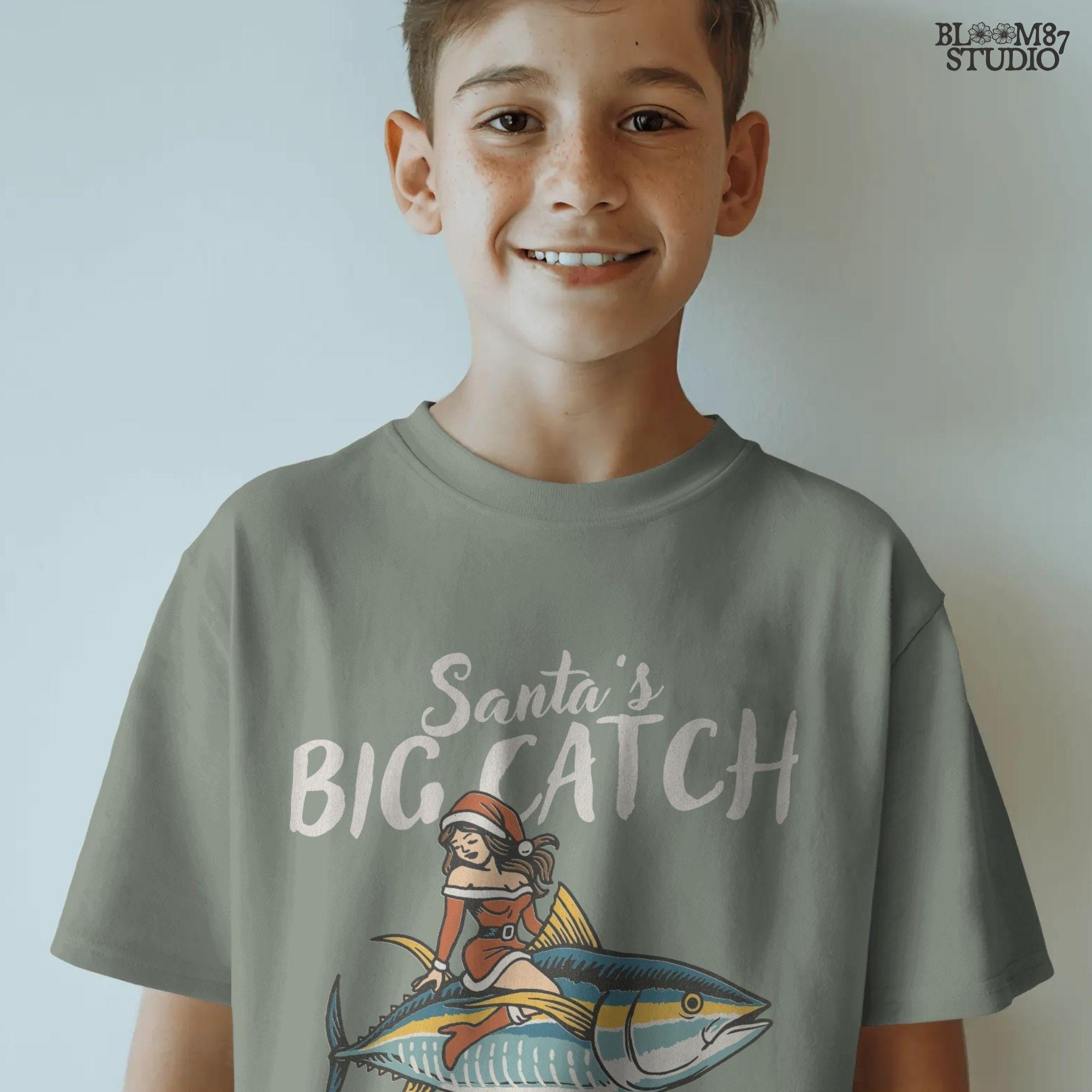 Retro holiday fishing PNG Santa’s Big Catch. Santa girl in Christmas dress rides a tuna fish, creating a fun fishing-themed holiday artwork. Perfect sublimation file for Christmas shirts, mugs, ornaments, and fisherman gifts. High-resolution PNG with transparent background, suitable for apparel printing and seasonal coastal decor.