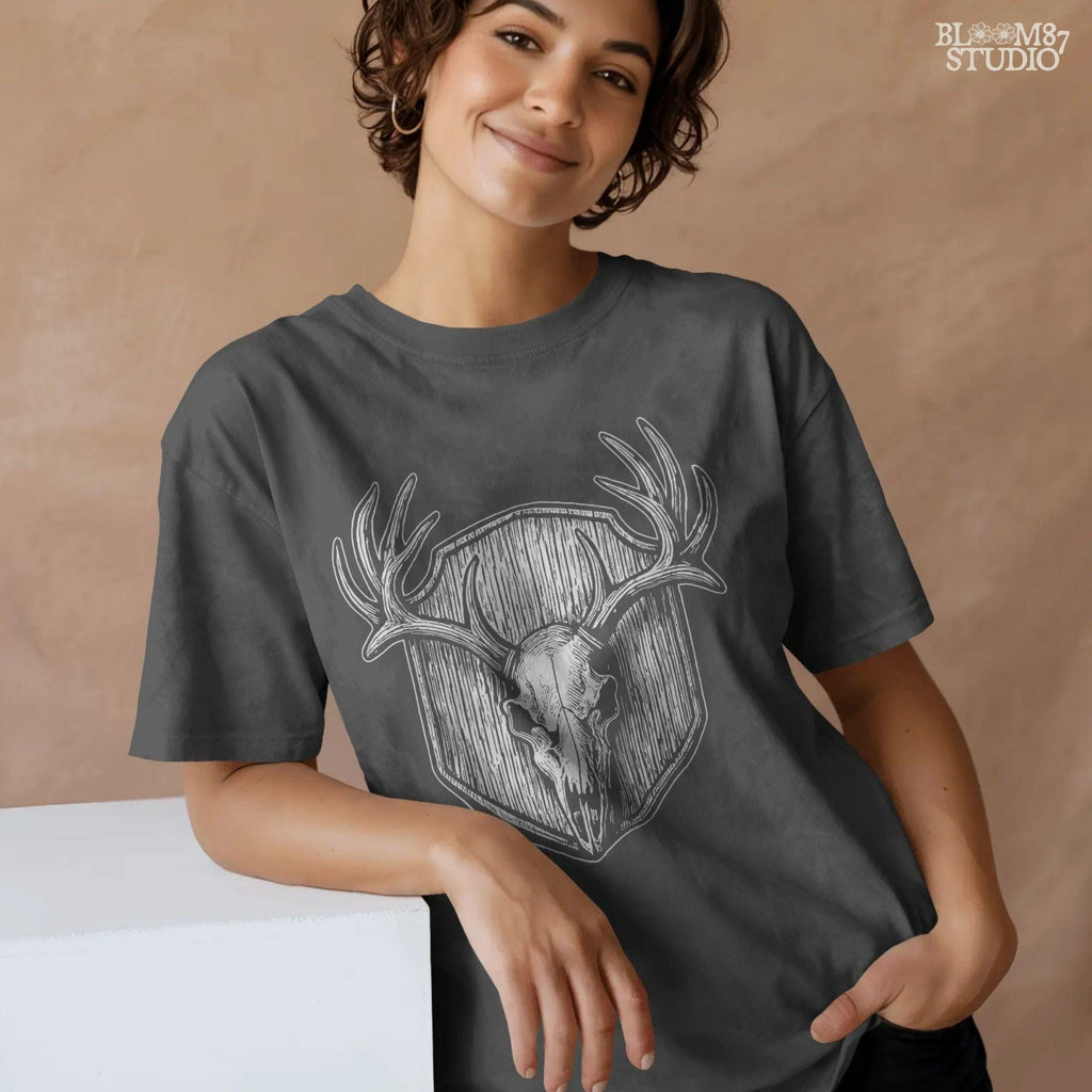 Rustic deer hunting skull PNG, featuring detailed antlers over wooden shield design. Use for sublimation on hunting shirts, mugs, tumblers, or rustic home decor. High-resolution clipart ideal for hunters and outdoor gifts.