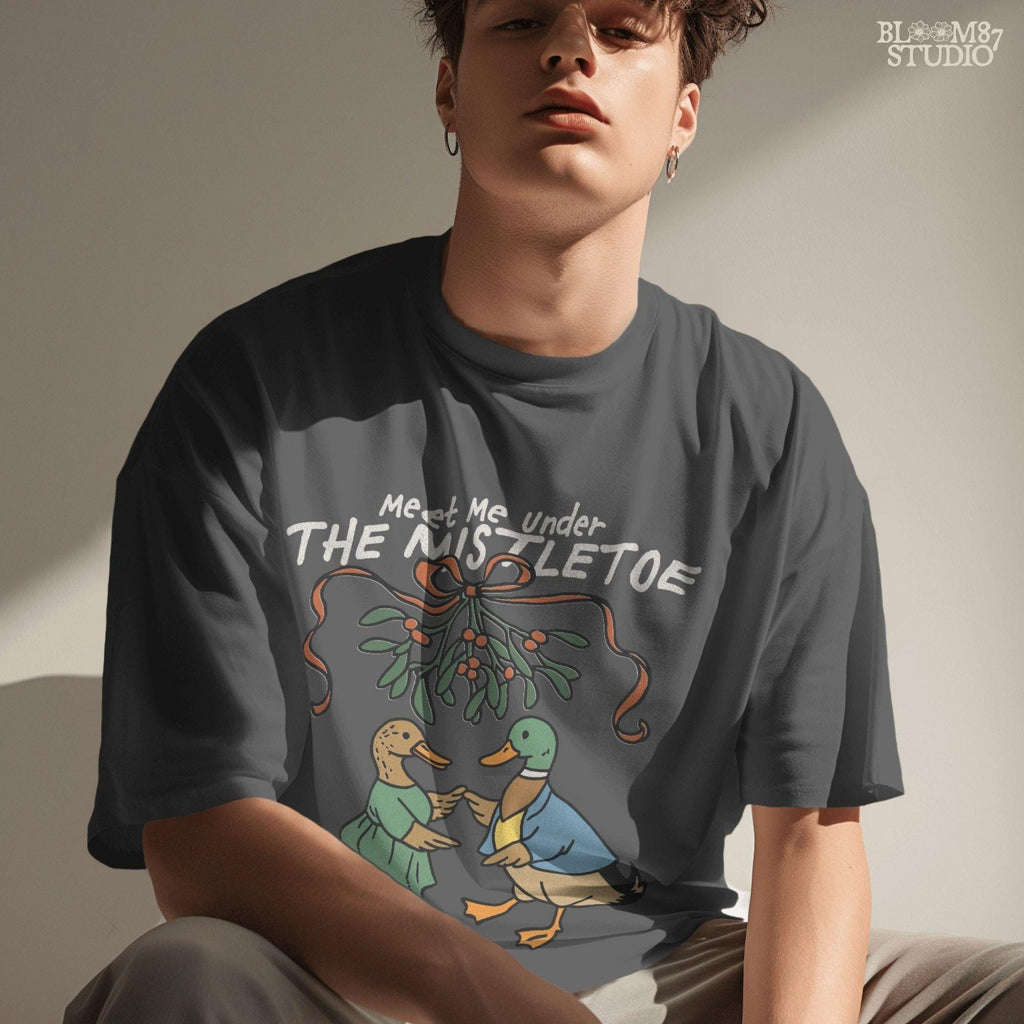 High-resolution duck couple in Christmas clothes, looking at each other under mistletoe with blue bow, great for printables.