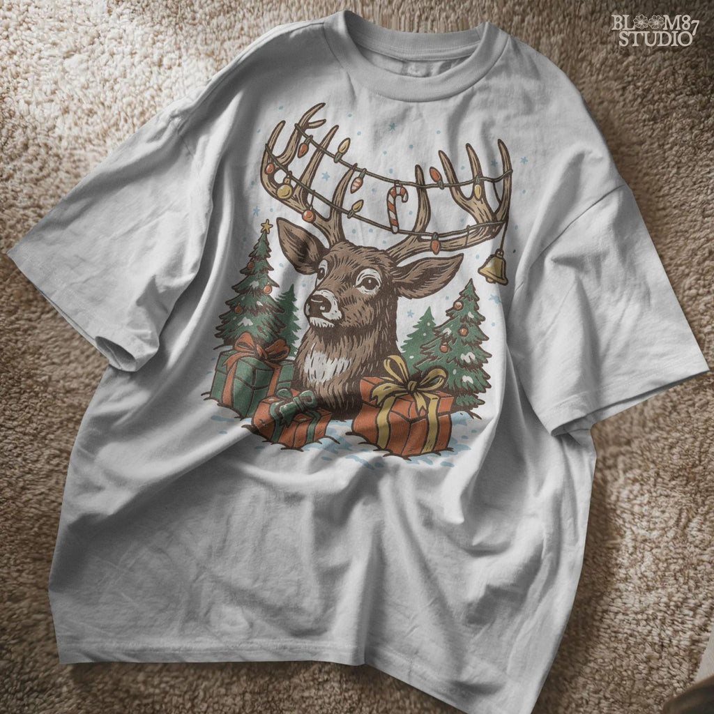 Winter holiday design showing a reindeer with Christmas decorations on antlers, surrounded by snowy trees and wrapped gifts. Sublimation PNG ideal for mugs, t-shirts, farmhouse Christmas signs, stickers, and holiday greeting cards.