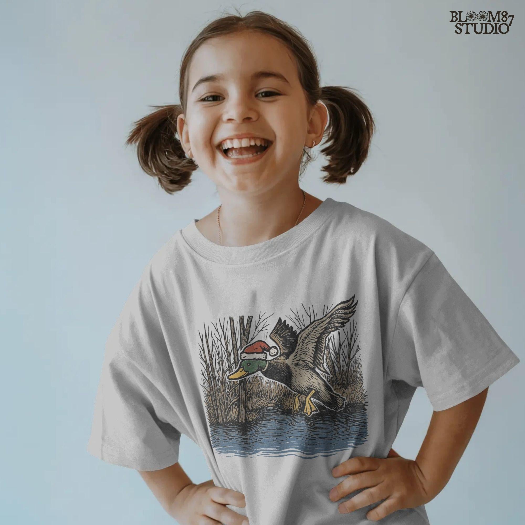 Duck hunting sublimation PNG with a festive twist—mallard duck in Santa hat, flying above water reeds. Ideal for Christmas hunting crafts, outdoorsman shirt designs, mugs, and unique gifts for hunters.