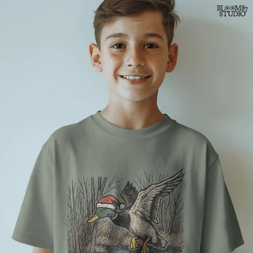 Christmas mallard duck PNG hand-drawn artwork for hunters. Features a mallard duck in Santa hat mid-flight. Perfect for holiday sublimation shirts, rustic farmhouse decor, mugs, tumblers, and outdoors gifts.