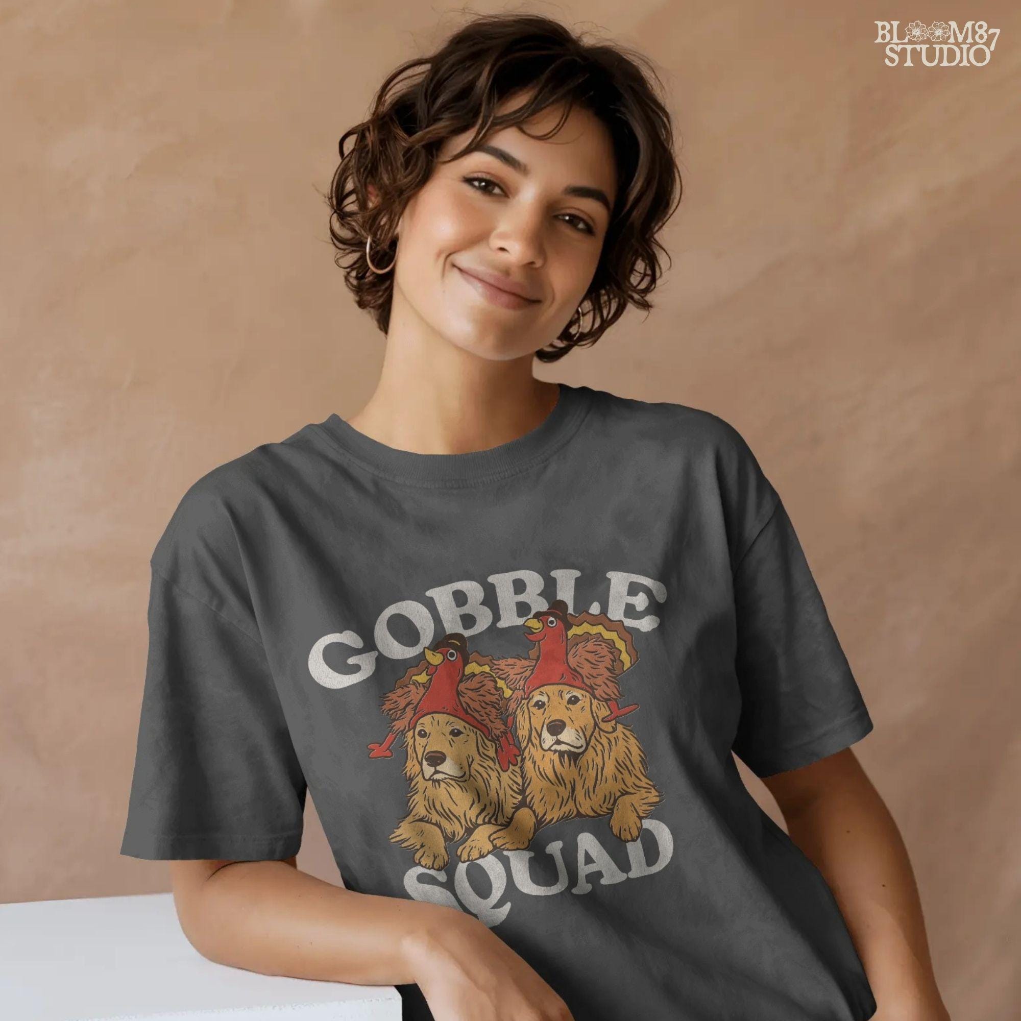 A rustic-style Thanksgiving PNG with dogs in turkey hats and Gobble Squad lettering. Great for funny Thanksgiving shirts, farmhouse kitchen towels, mugs, and printable wall decor.