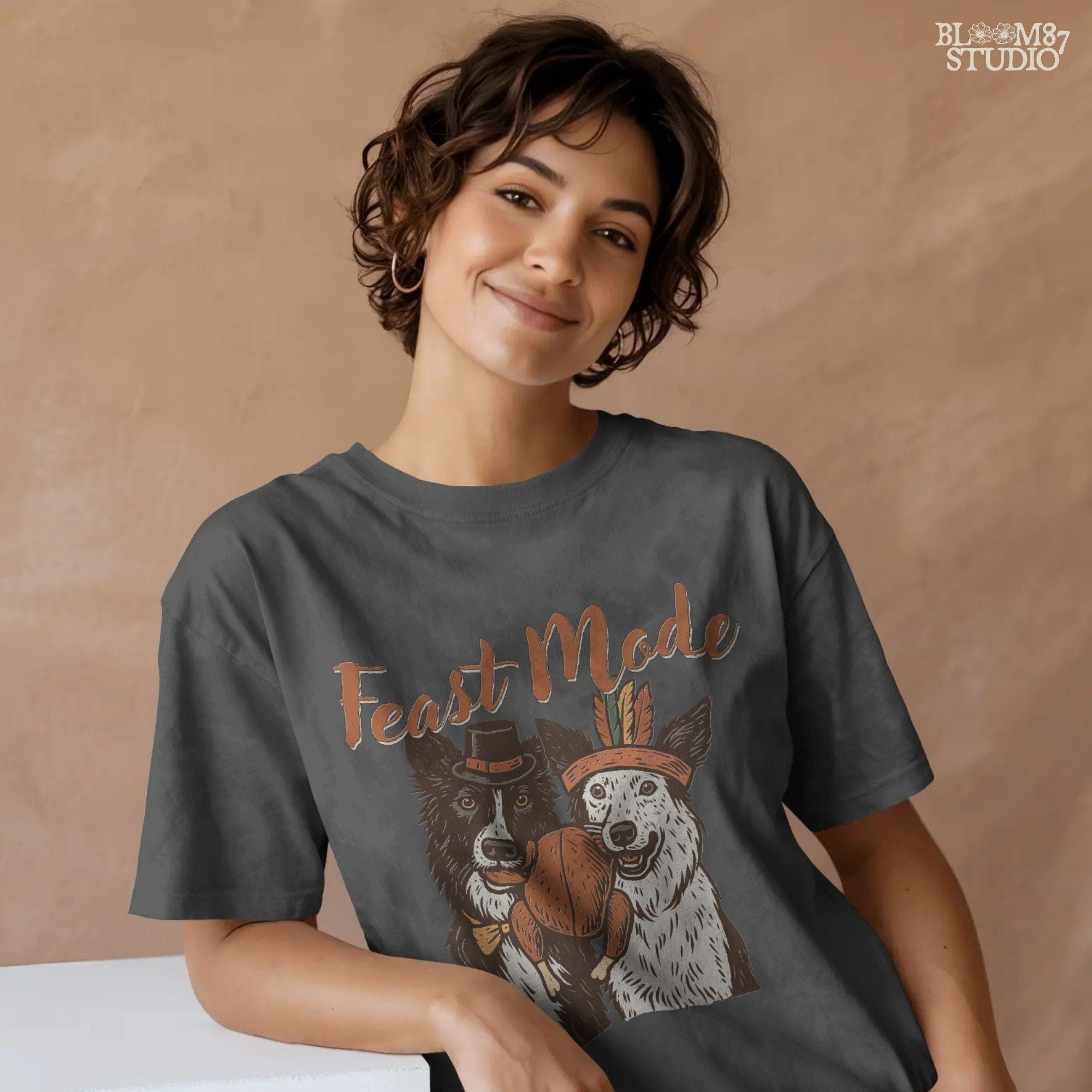 Hand-drawn Feast Mode sublimation PNG design featuring dogs with a turkey dinner. Great for holiday apparel, farmhouse decorations, mugs, tumblers, and unique dog lover Thanksgiving gifts.